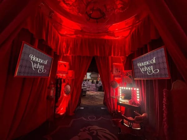 Richly draped themed entrance and styling at a gala dinner